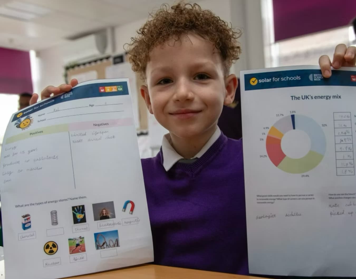 Happy child showing work